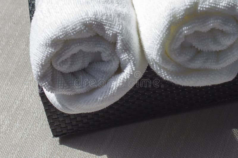 White cotton towel. A piece of beauty salon or bathroom interior.