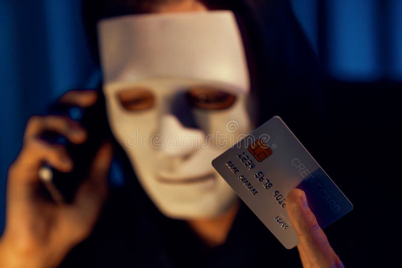 White criminal mask calling to credit card owner to threaten ransom. Pecuniary. stock photography