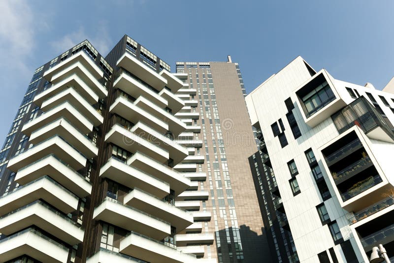 White and dark brown futuristic apartment building architecture. 01.2020 Milan. White and dark brown futuristic apartment building architecture. 01.2020 Milan royalty free stock photo White and dark brown futuristic apartment building architecture. 01.2020 Milan. White and dark brown futuristic apartment building architecture. 01.2020 Milan royalty free stock photo