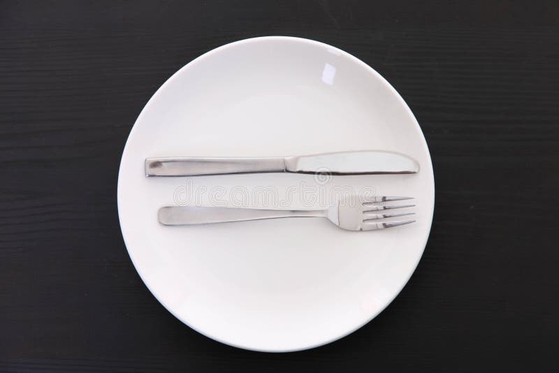 White Dish on the Black Table with Cutlery Meaning EXCELLENT Stock