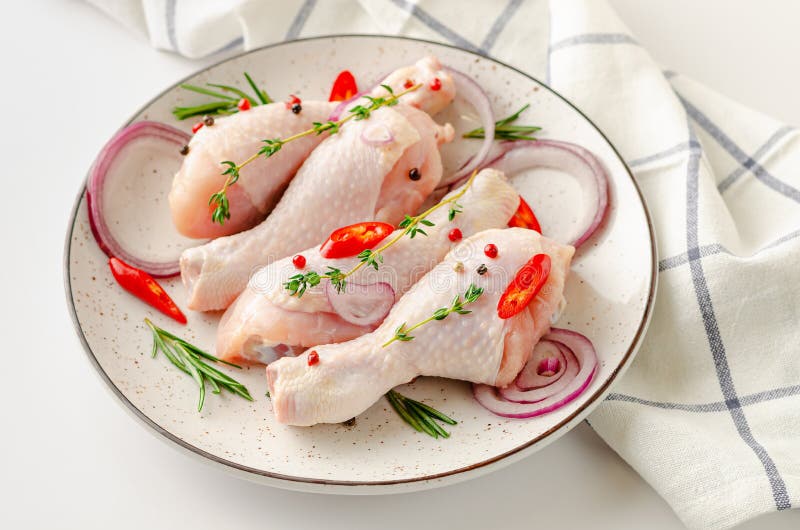 Spicy Marinated Raw Chicken Legs or Drumsticks Levitation. Flying Food