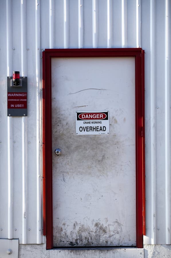 White Door with Danger Sign