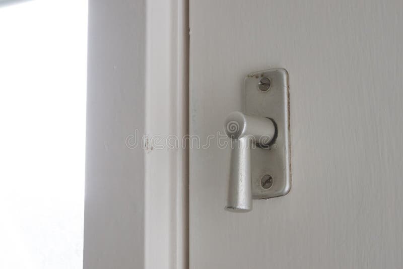 White door with security lock doorhandle royalty free stock image