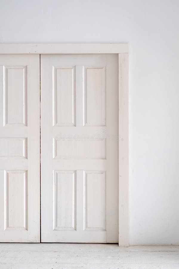 White Double Doors on a White Wall. Geometric Background Stock Image
