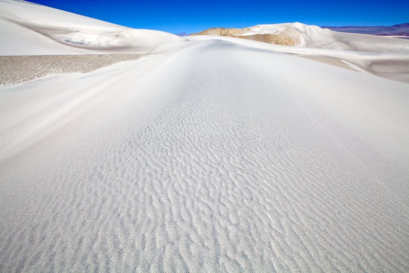 White dune at the lava field of the volcano Caraci Pampa at the Puna de Atacama, Argentina