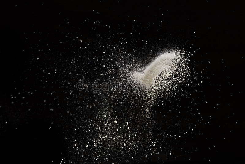 White dust debris isolated on black background