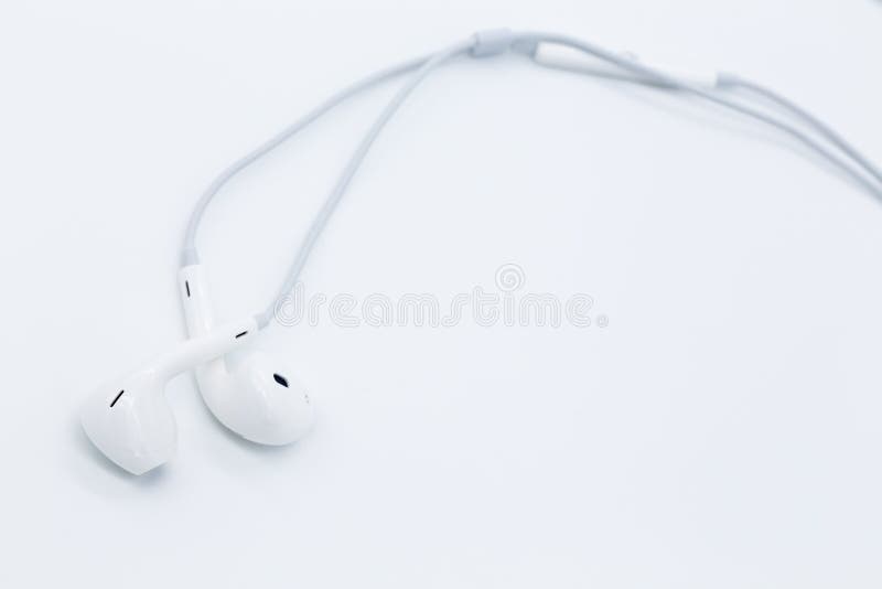 White earbuds on white background
