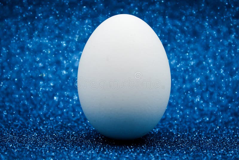 White Egg with Blue Background. Stock Photo Image of time
