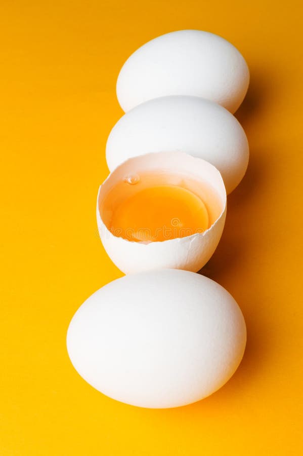 White Eggs and Egg Yolk on the Yellow Background Stock Photo Image of