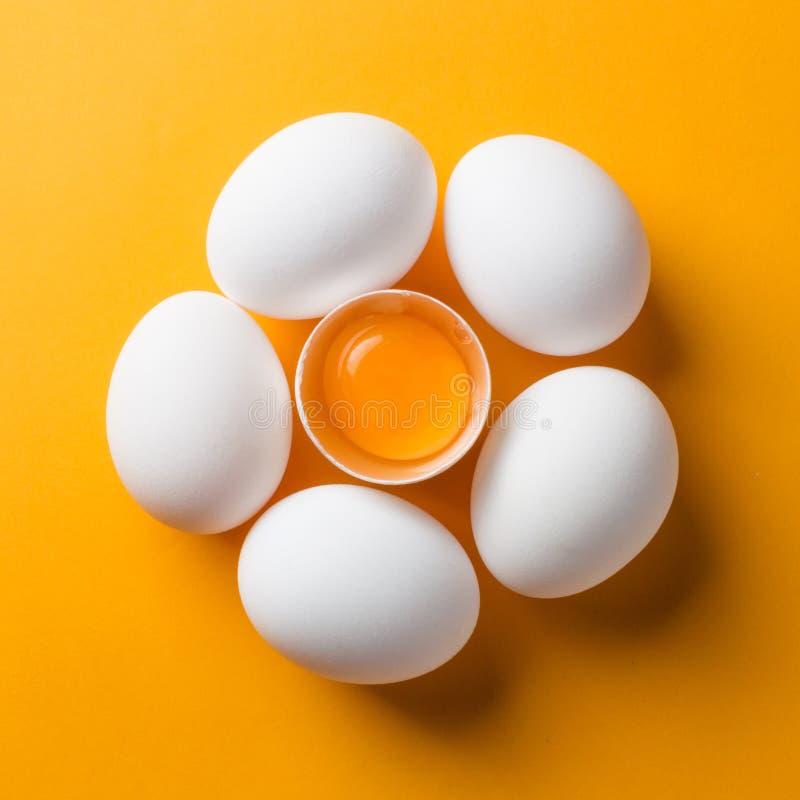 White Eggs and Egg Yolk on the Yellow Background. Topview, Square Stock