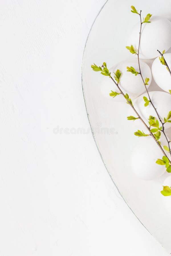 White eggs spring twigs platter