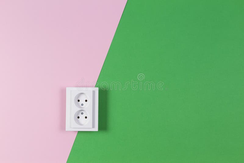 White Electrical Power Socket and Power Plug on Light Pink Background