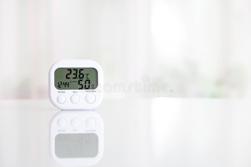 https://thumbs.dreamstime.com/b/white-electronic-hygrometer-table-front-window-thermometer-shows-comfort-temperature-humidity-149368139.jpg
