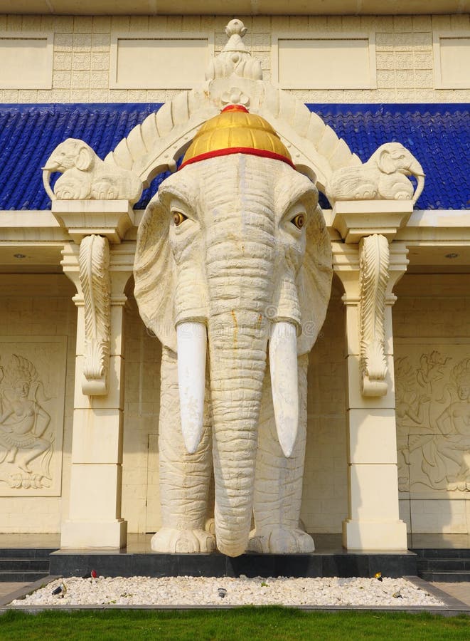 White Elephant Statue Standing in Front of the Building Stock Photo
