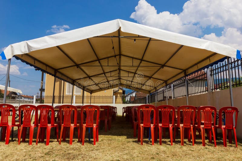 White Entertainment Tent with Red Plastic Chairs Stock Image Image of