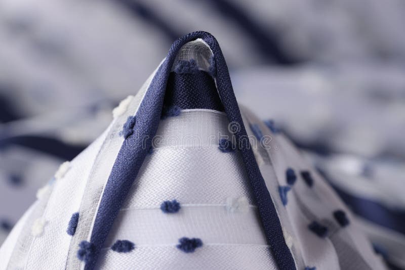 White fabric with blue cone inserts closeup stock image