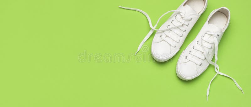 White Female Fashion Sneakers On Green Background. Flat Lay Top View ...