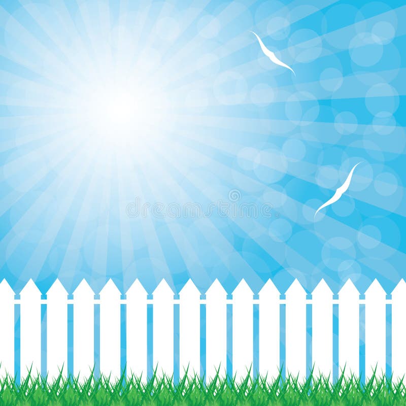 White fence and green grass on blue sky background