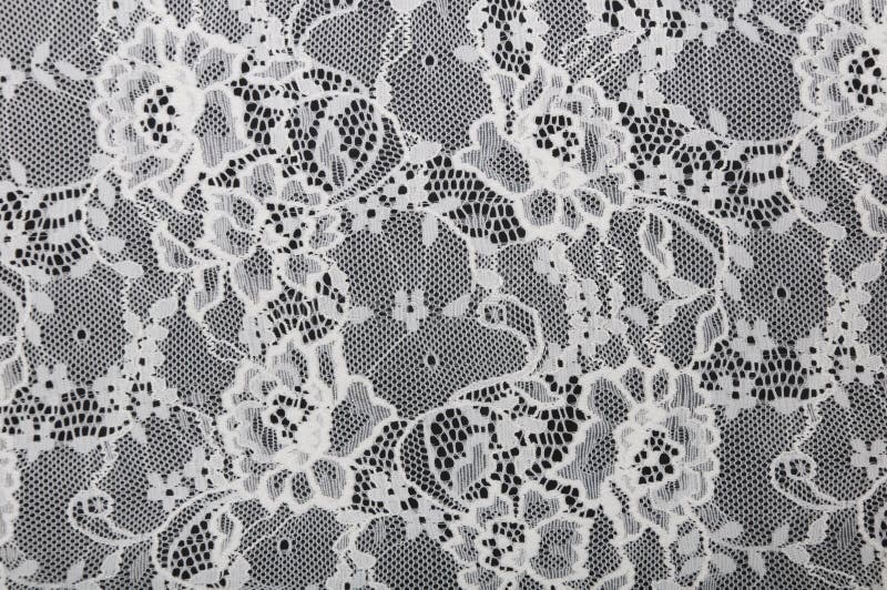 White floral lace on a black