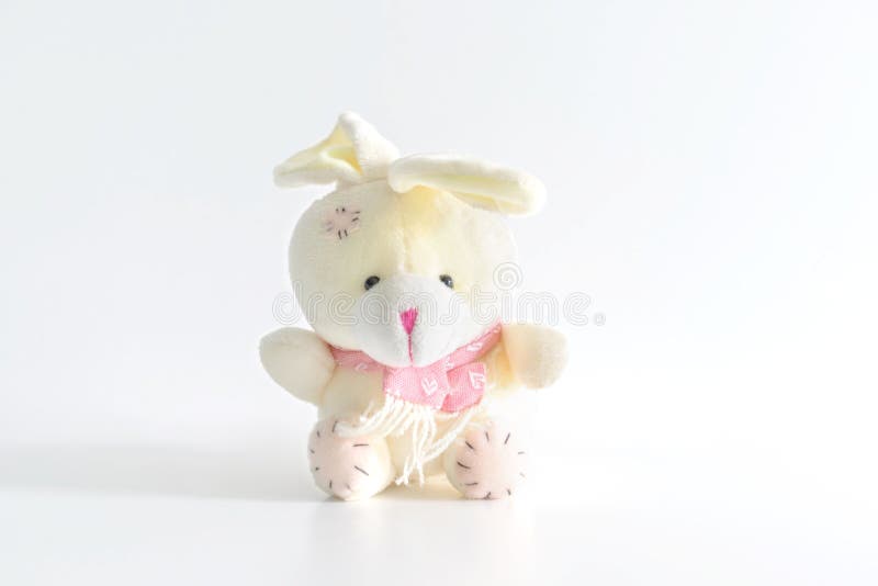 White Fluffy Bunny Rabbit Toy Sitting on White Background with Copy