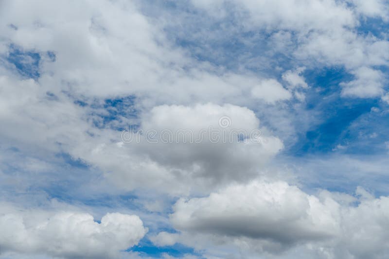 White, Fluffy Clouds in Blue Sky. Background from Clouds Stock Photo