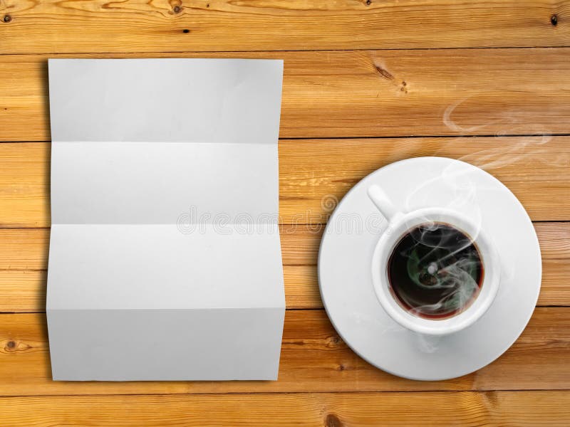 White fold paper and a white coffee cup