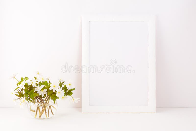 White frame mockup with Rue Anemone flowers. Elegant, style.