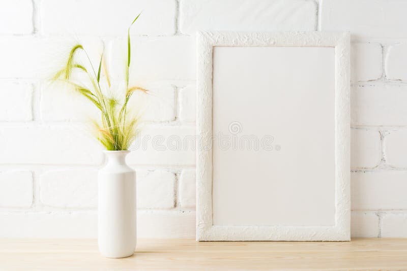 White frame mockup with yellow and green wild grass ears