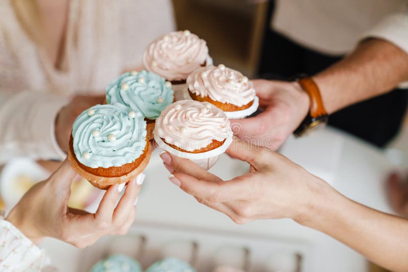 White Friends Holding Muffins during Gender Reveal Party Stock Photo Image of young, gender
