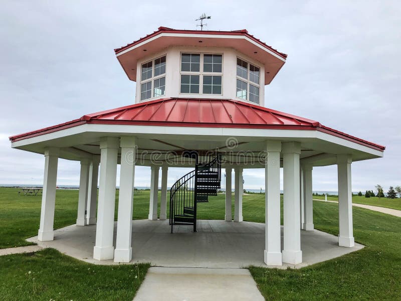 White gazebo with red roof and spiral staircase stock image White gazebo with red roof and spiral staircase stock image
