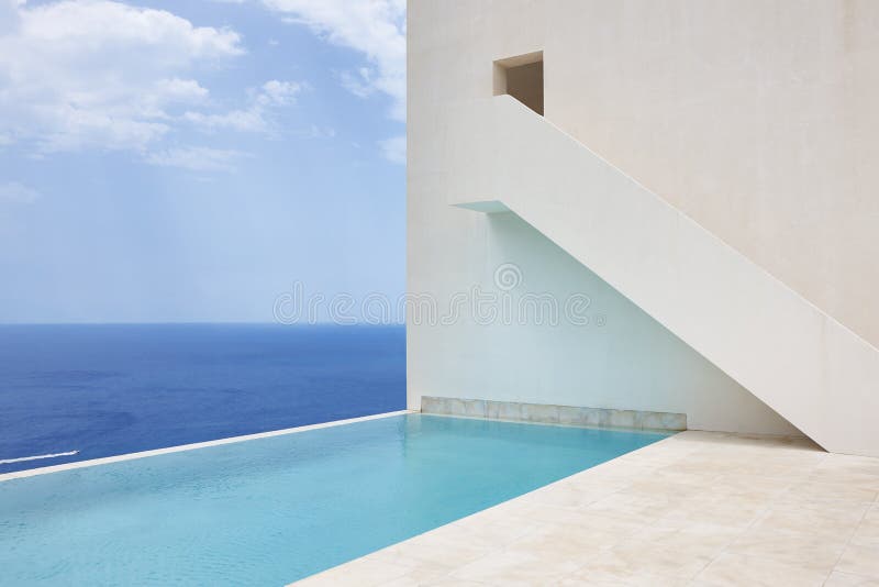 White geometric building facade and swimming pool. Mediterranean shoreline