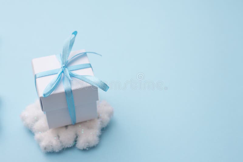 White Gift Box on Blue Background with Snowflake, Copy Space for Season  Greeting Happy New Year, AF Point Selection and Blurred Stock Image - Image  of gift, background: 163295857