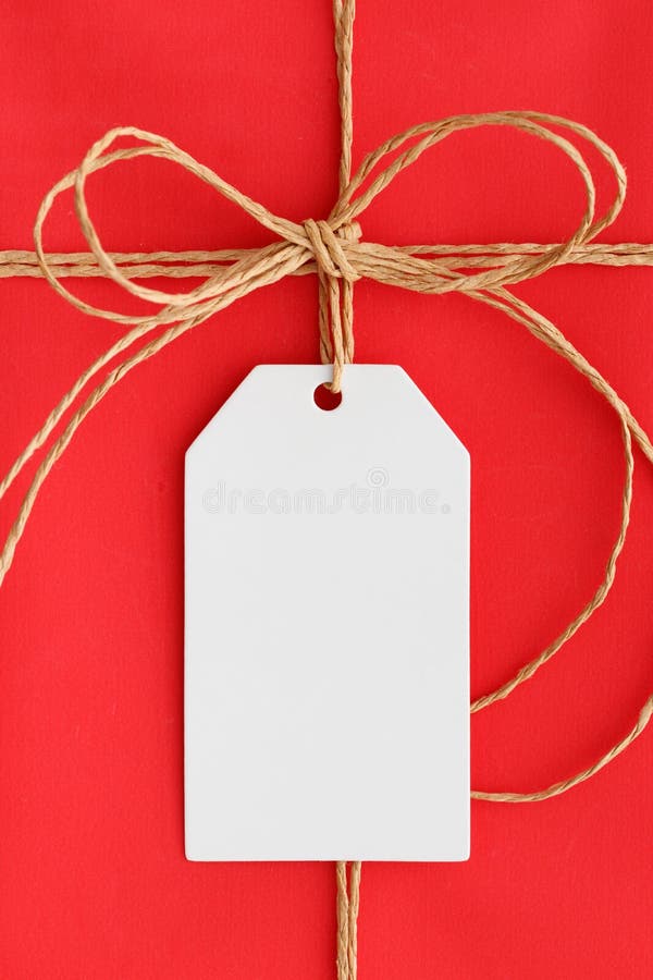 White Gift Tag Mockup on a Red Christmas Gift Stock Image Image of