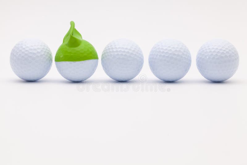White Golf Balls With Funny Cap On The White Background. Stock Photo Image of blank, focus