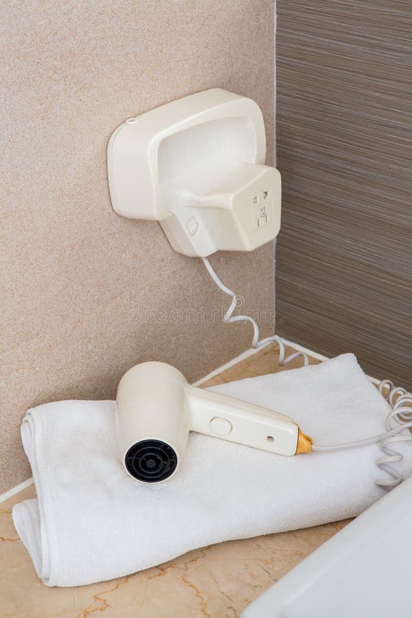 White Hair Dryer on the Towel in the Bathroom Stock Image Image of