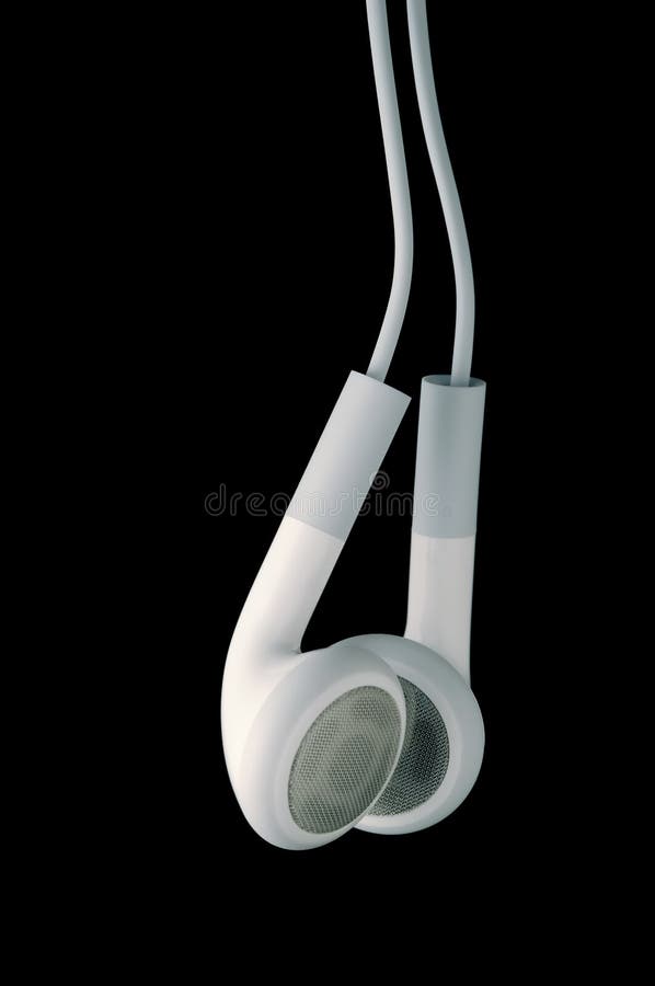 This is a pair of white headphone or earbuds photographed on a black background. This is a pair of white headphone or earbuds photographed on a black background.