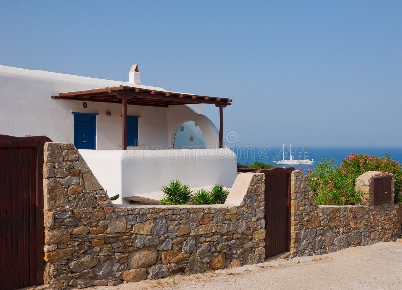 White house behind a stone fence royalty free stock images