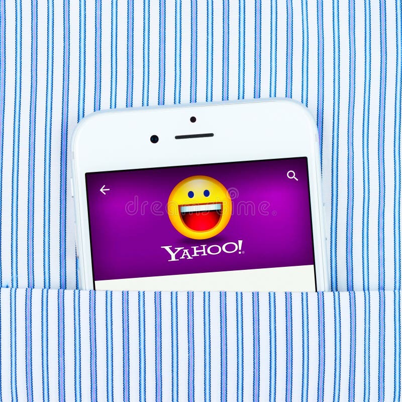 Simferopol, Russia - April 18, 2015: White Apple iPhone 6 in the pocket displaying Yahoo application. Yahoo Inc. is an American multinational Internet corporation headquartered in California. Simferopol, Russia - April 18, 2015: White Apple iPhone 6 in the pocket displaying Yahoo application. Yahoo Inc. is an American multinational Internet corporation headquartered in California