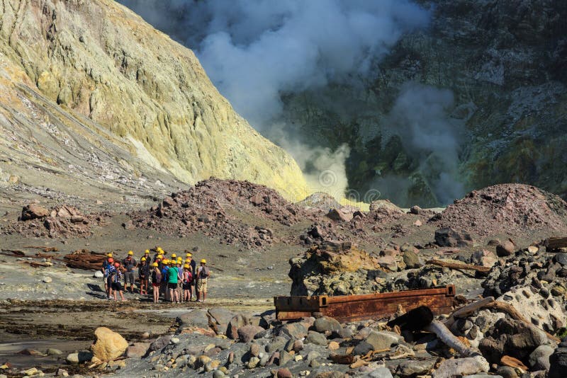 White Island, New Zealand. Tourists in a landscape of volcanic steam and sulfur stock image White Island, New Zealand. Tourists in a landscape of volcanic steam and sulfur stock image