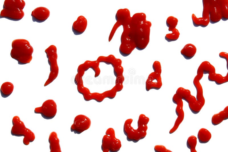 On a white isolated background smeared many times with tomato sauce. royalty free stock images