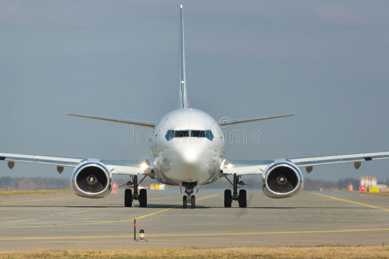 White jet on runway stock photo. Image of cargo, transportation - 64118630