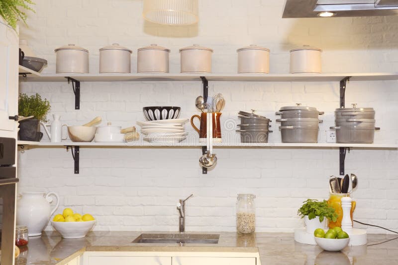 White Kitchen, Colorful Fruits on Granite Counter, Pots and Plates on Shelves