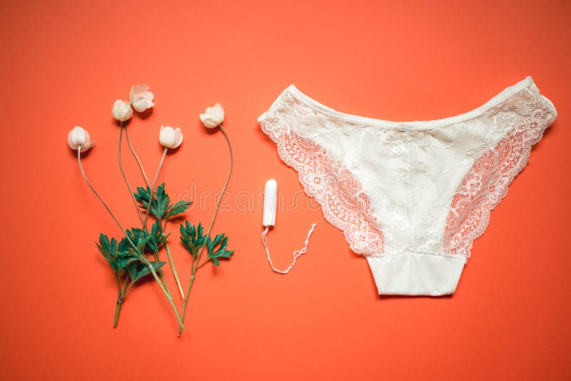 https://thumbs.dreamstime.com/b/white-lace-panties-tampon-coral-background-female-underwear-bride-delicate-flowers-orange-154389663.jpg