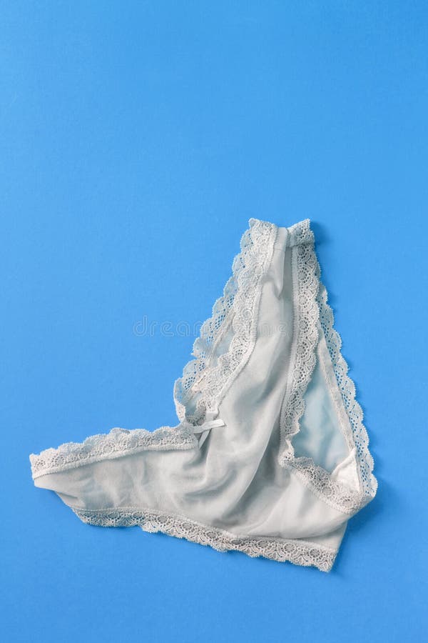Panties on blue background stock photo. Image of clothes 254987310