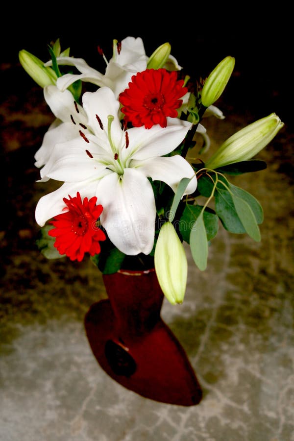 White lily bouquet in Chinese terracotta vase. White lily bouquet in Chinese terracotta vase