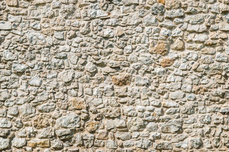 White limestone rock brick wall background royalty free stock images