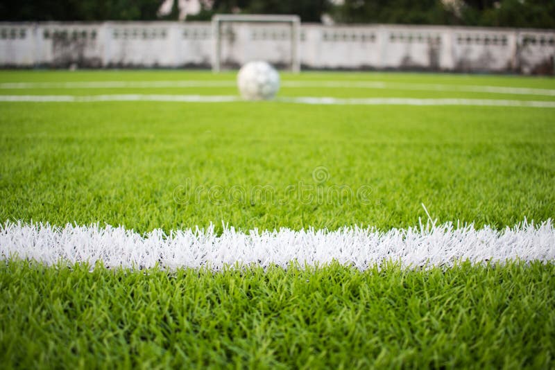 The white Line marking on the artificial green grass footbal, soccer field stock photography