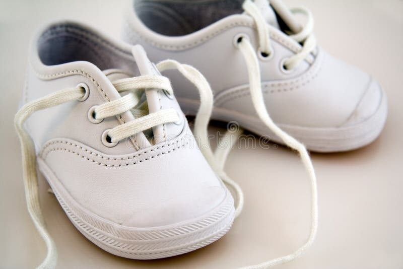 White Little Baby Shoes royalty free stock image