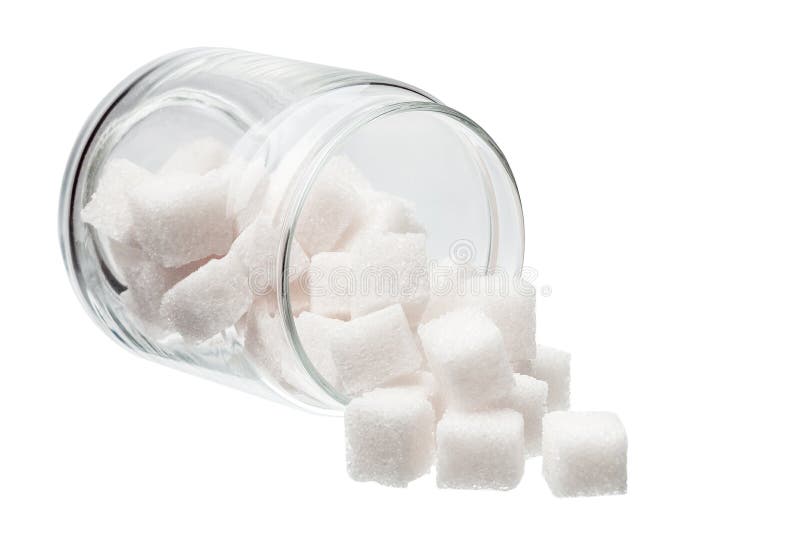 White lump sugar in a glass jar on a white background, sweet sugar in the ware lying on one side nobody. White lump sugar in a glass jar on a white background, sweet sugar in the ware lying on one side nobody.