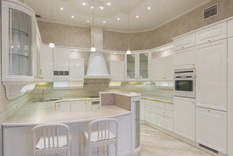 White luxury kitchen in a modern home stock image White luxury kitchen in a modern home stock image
